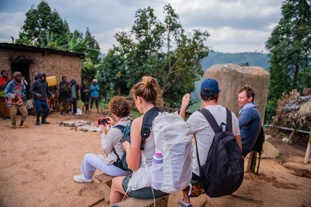 Clients from Hillary Uganda Trips attending the Batwa Cultural experience in lake Bunyonyi
