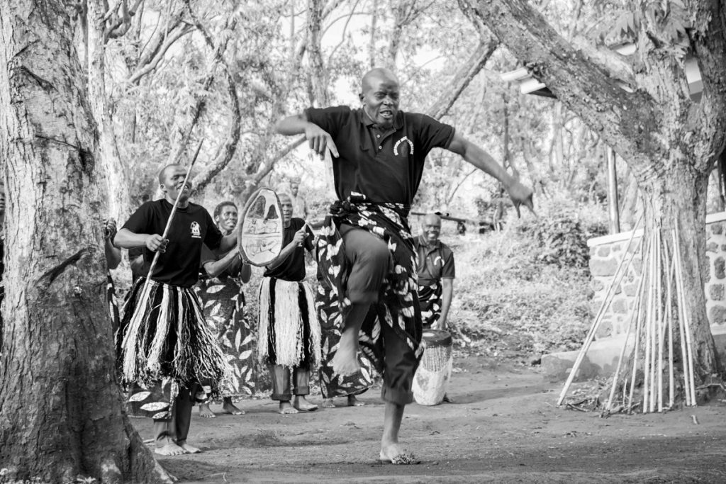 Traditional dances from the community before going golden monkey tracking in Uganda with Hillary