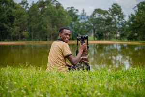 A seasoned local wildlife photographer in Uganda doing photo safaris